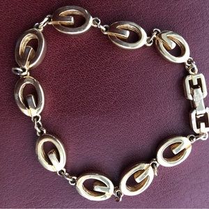 Givenchy gold tone G link bracelet.